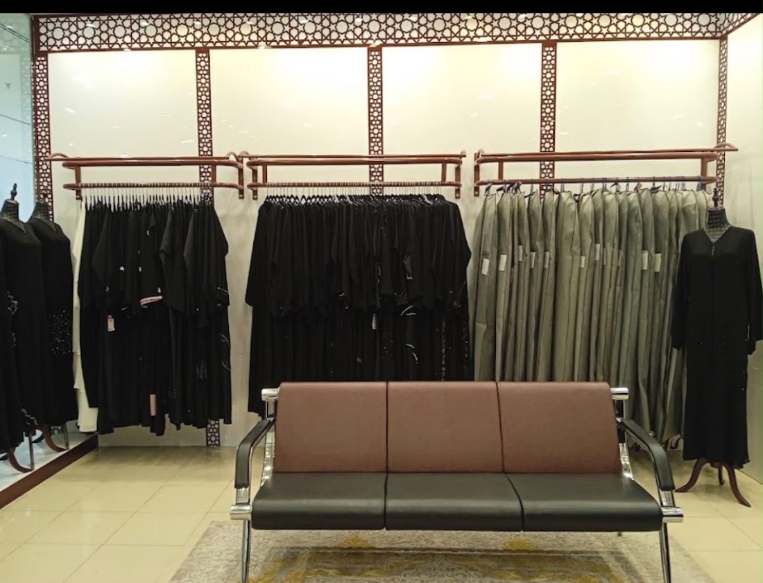 Boutique interior with abaya rails and seating